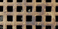 vent/drain square pattern rusty industrial metal dark brown multicolored black   