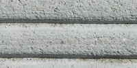 horizontal grooved industrial concrete gray floor