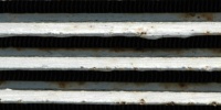 vent/drain horizontal shadow weathered industrial metal gray