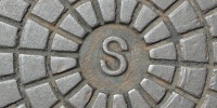 manhole pattern textual shiny industrial metal metallic