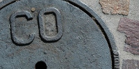 manhole round textual industrial metal brick dark brown