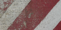 red white multicolored paint concrete vehicle scratched angled symbol street