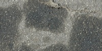 gray asphalt vehicle stained random spots street