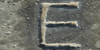 gray concrete industrial textual shadow spots manhole