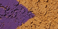 symbol wall triangular rough architectural stucco/plaster paint purple yellow